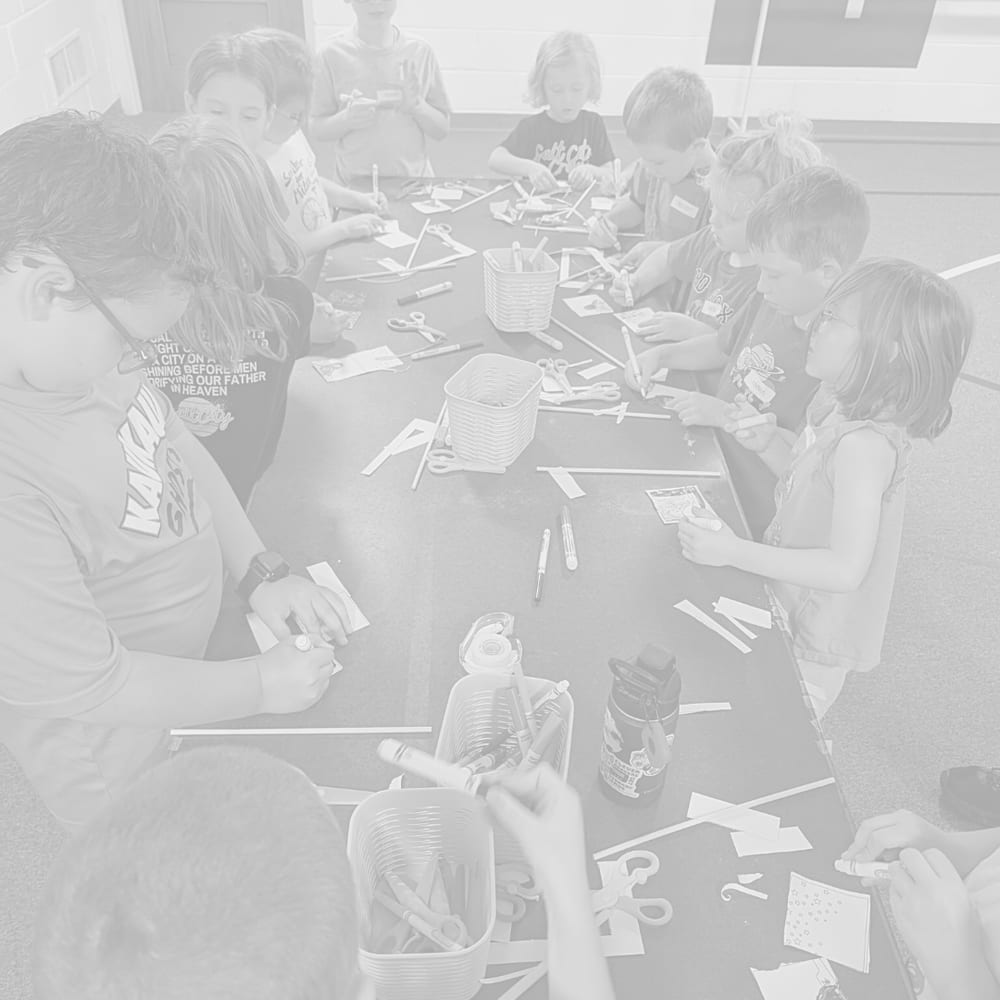 Children doing crafts during Olivet Kids